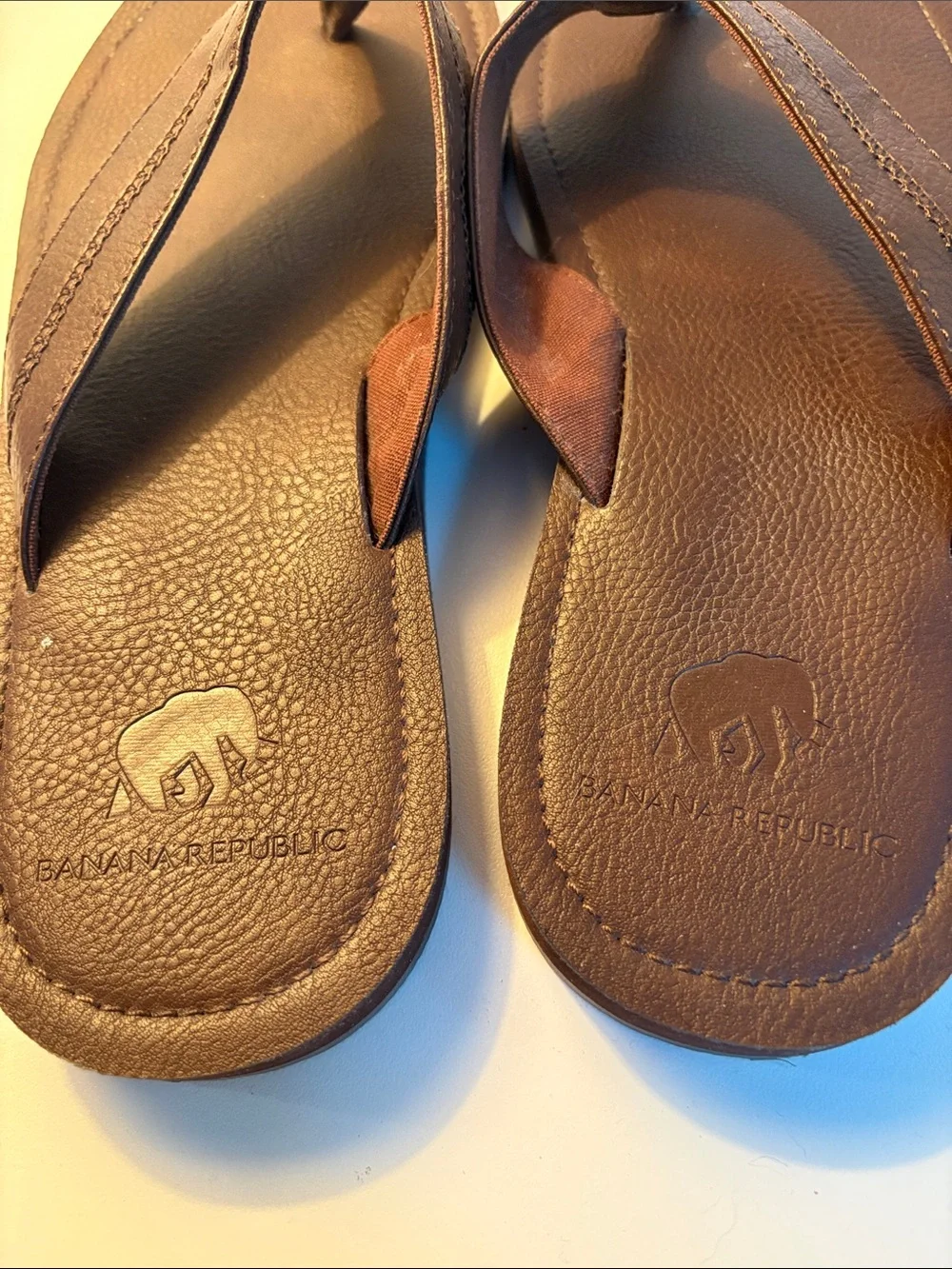 THREE pairs of men’s flip flops